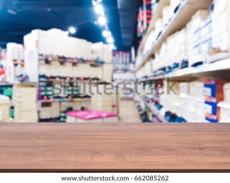 Brown wooden board empty table in front of blurred background. Perspective white wood over blur in supermarket - can be used for display or montage your products. Mockup for display of product.