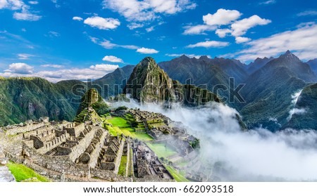 Machu Picchu, Cusco region, Peru: Overview of agriculture terraces, Wayna Picchu and surrounding mountains in the background, UNESCO, World Heritage Site. One of the New Seven Wonders of the World Royalty-Free Stock Photo #662093518
