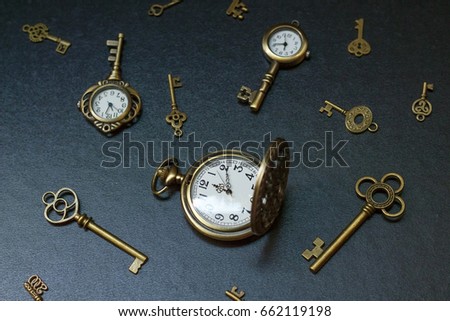 pocket watch and old keys. Vintage Wonderland background. Soft selective focus