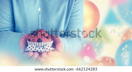 Kid boy holding birthday cake with candle, closeup