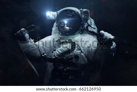 Astronaut. Science fiction space wallpaper, incredibly beautiful planets, galaxies, dark and cold beauty of endless universe. Elements of this image furnished by NASA