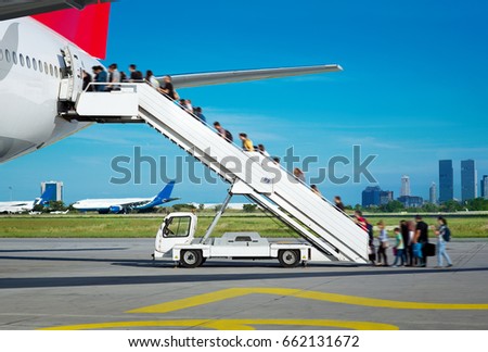 People boarding from apron Royalty-Free Stock Photo #662131672