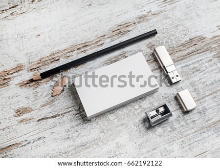 Template for ID. Responsive design mockup. Bank business cards, pencil, flash drive and sharpener on vintage wooden table background. Top view.