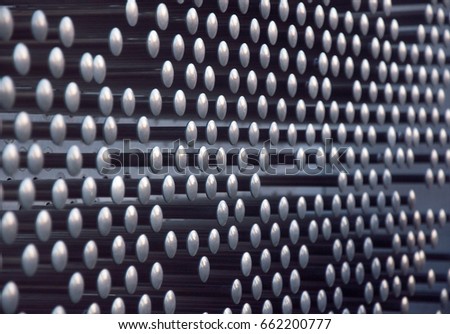 Abstract background with metal rods with round convex tops