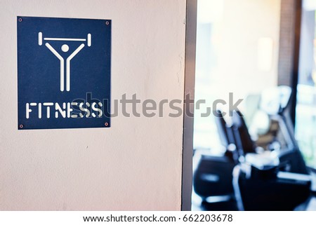 Fitness sign board on gym door.