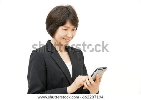 smiling Asian woman with smart phone