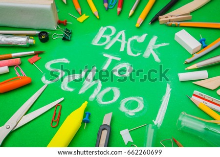 School supplies on Green chalkboard " Back to school background "