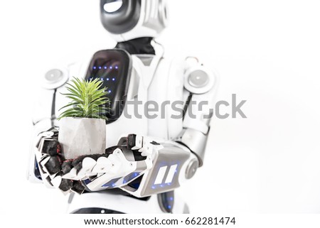 Modern cyborg keeping little herb
