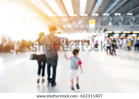 abstract blurred picture of people in international airport for background.