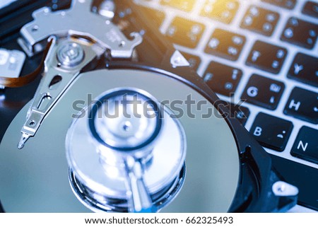 Close-up of stethoscope on laptop and Hard Disk                       