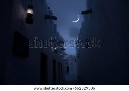 Beautiful view of crescent through a narrow passage of an old Islamic architecture. An Eid moon sighting image. Royalty-Free Stock Photo #662329306