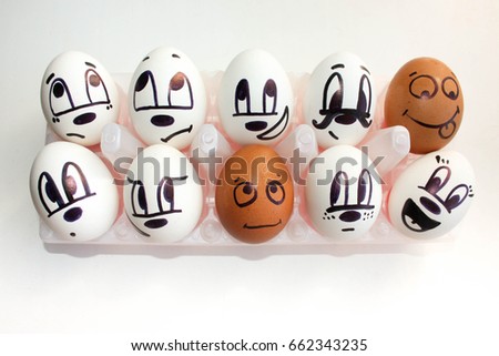 Interracial complexity of communication concept. Eggs in the cells. With a painted face. black and white. on a white background. Photo for your design