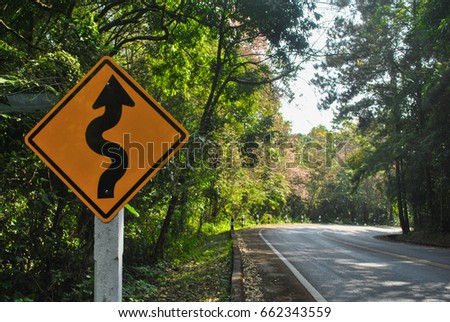 Road sign on the way up to mountain in Thailand saying that the road is twist