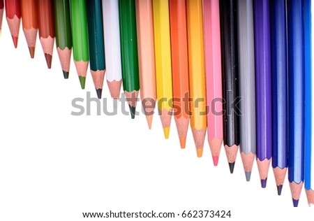 Many colored pencils isolated on white background, place for text.