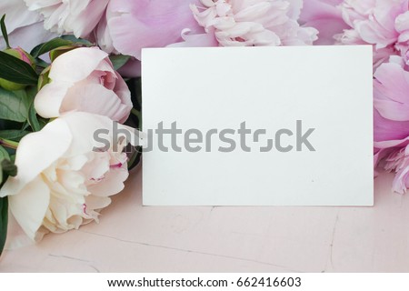 card mockup with flowers.
peony, invitation and ribbon