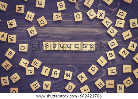 Success word on wood table for business concept.