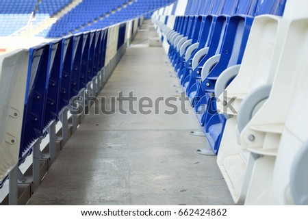 seats at stadium in blue
