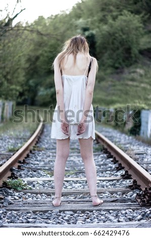 Girl Tied To Tracks