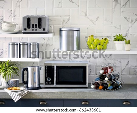 Microwave the kitchenware home appliance isolated in the kitchen interior Royalty-Free Stock Photo #662433601