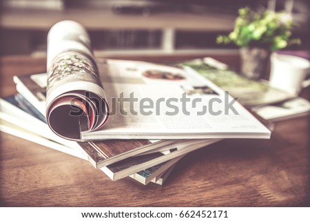 selective focus of the stacking magazine place on table in living room Royalty-Free Stock Photo #662452171