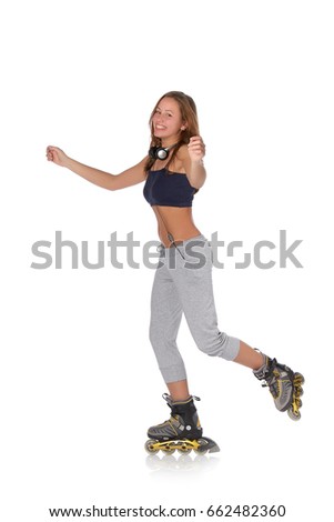 The beautiful girl with earphones in rollerskates on a white background.
