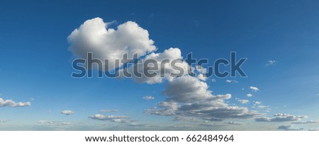 Fluffy clouds in a blue sky 