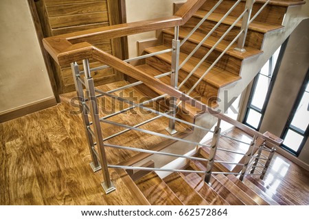 Indoor Concrete Staircase with wood handrail in the building