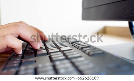 Men's hand using keyboard computer.