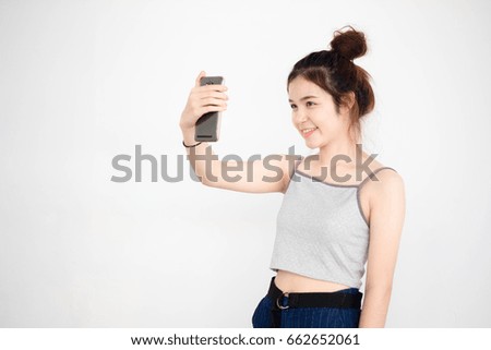Portrait of thai adult beautiful girl using her smart phone Selfie