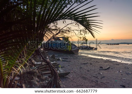 abandoned shipwreck with wooden jetty in the background