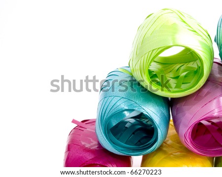 Closeup picture of colorful hanks of ribbons on white background. Available space for text
