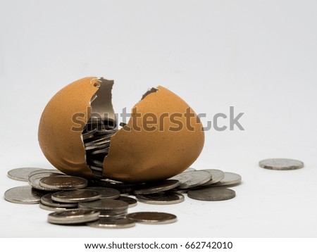 Money with egg in white background, this picture for finance concept