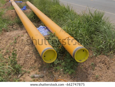  Yellow Plastic Drainage Pipe on a Construction Site .Plastic pipe stacked sewage and water system aligned on site.