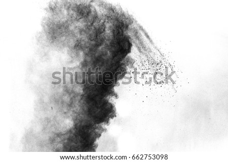 particles of charcoal on white background,abstract powder splatted on white background,Freeze motion of black powder exploding.