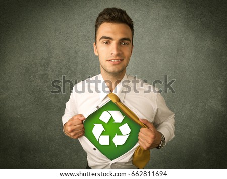 Enviromentalist business man tearing off shirt with recycle sign on his chest concept on backround