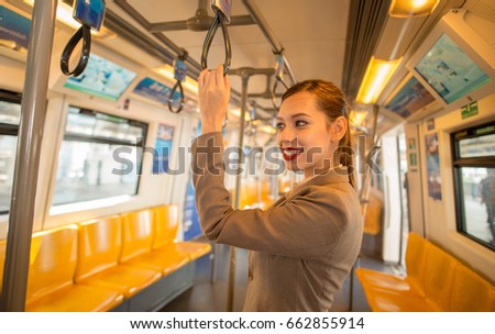 Beautiful women in Electric train.