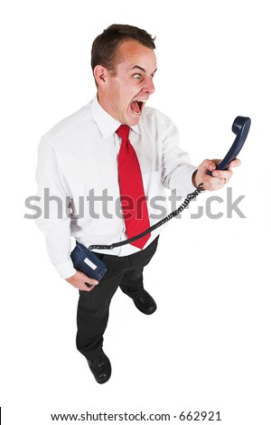 Businessman in black leather trousers, white shirt and red tie. Yelling at telephone