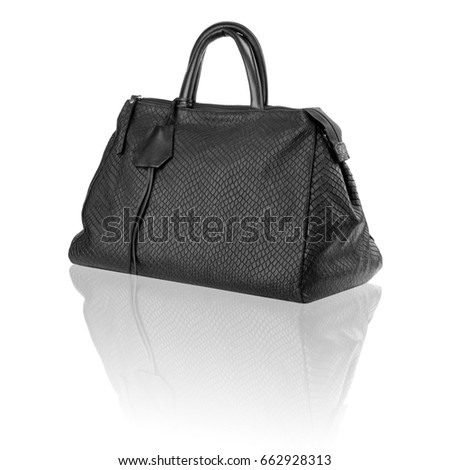Black handbag on reflected surface.Isolated on white background.