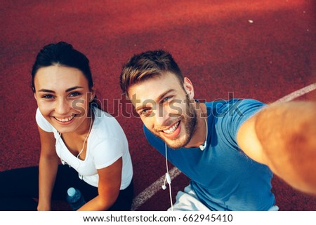 Young happy couple doing selfie 