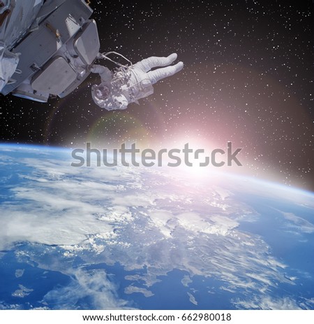Astronaut and earth globe in the deep space. "The elements of this image furnished by NASA"
