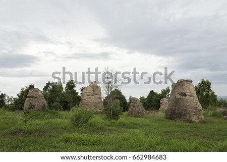 The old stone shape is strange on the mountain, white stone and grass fields beautiful grass,mor-hin-khao Chaiyaphum.