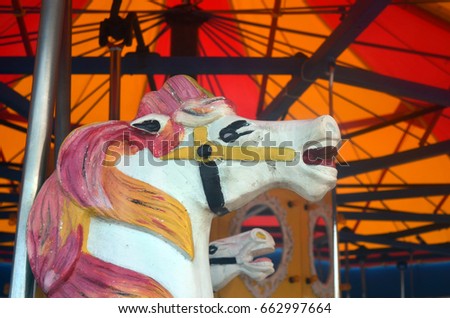 Carousel horse on carnival merry go round 