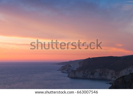 Colorful dramatic sunset. Cape Keri in the southwest of Greek island Zakynthos in the Ionian Sea