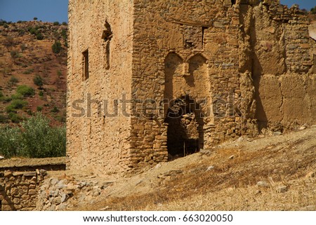 ruin of a kasbah against sky in a sunny day - bine el ouidane - morocco