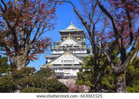 Osaka castle with trees and clear blue sky background in sunny day in Osaka, Japan