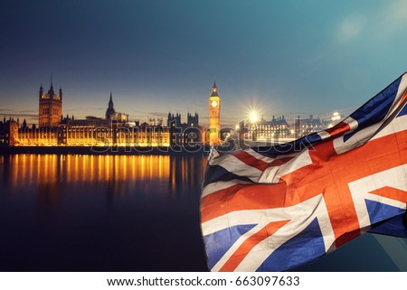 British union jack flag and Big Ben Clock Tower and Parliament house at city of Westminster in the background - UK votes to leave the EU, Brexit concept