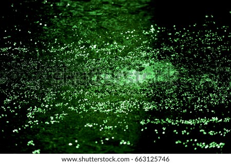 Green background created from picture of water splash and spread from water surface.

