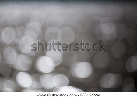 Grey background created from picture of water bokeh.
