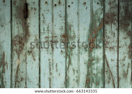 Grey brown background created from picture of wooden plank wall.
