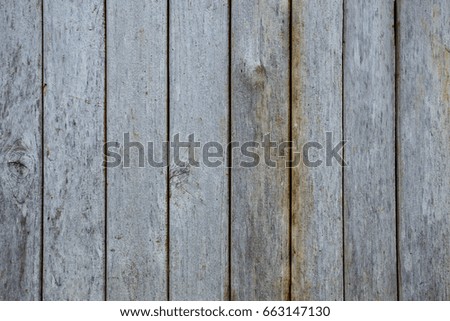 Grey background created from picture of wooden plank wall surface.

